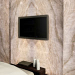 A soft white background with subtle gold veins.