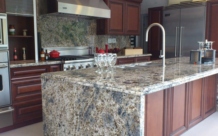 Blue Flower Granite A white stone swirled with blue, grey, and brown bits.