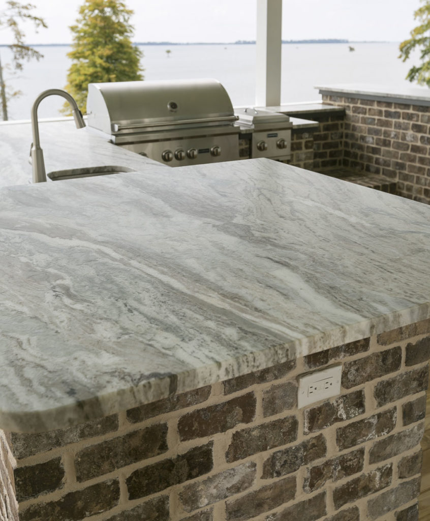 Fantasy Brown Marble A flowing pattern of pewter, golden, and cocoa tones.