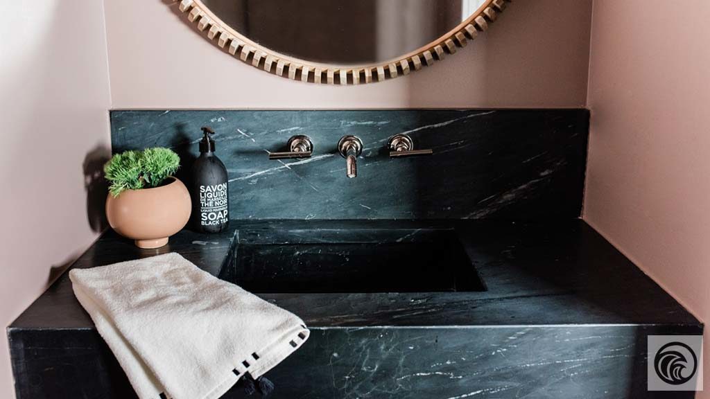 Black Soapstone A velvet black surface with deep grey and white veining running across.