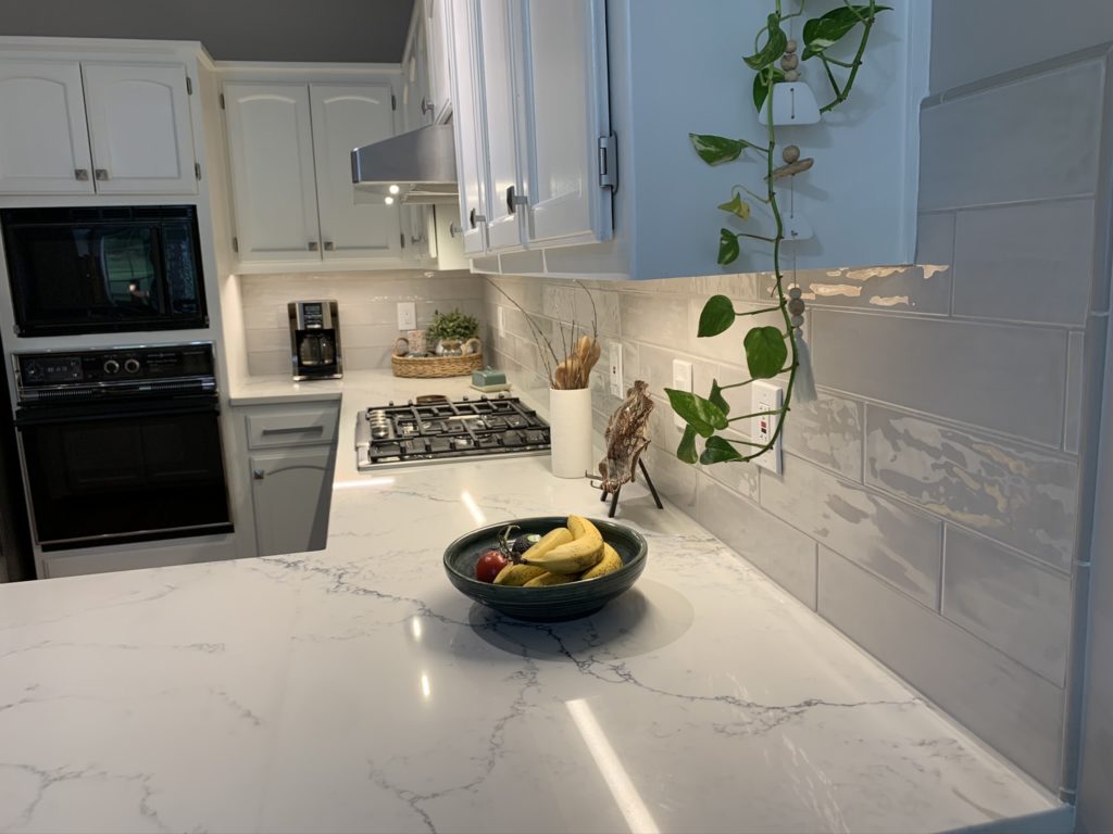 Pacshore Quartz Calacatta Lincoln Sporadic veining flows across the surface, yet provides a cohesive look.